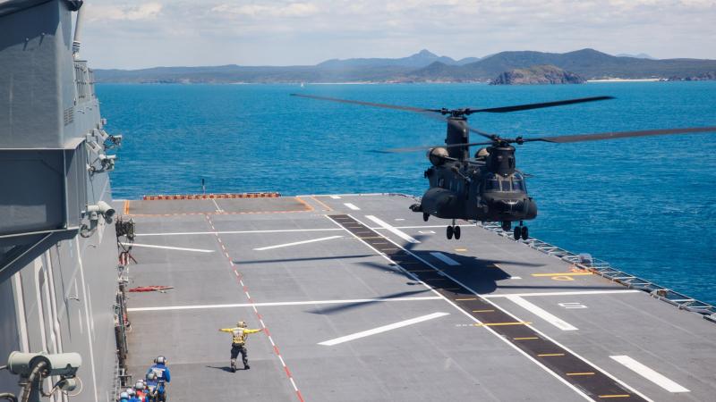 A Republic of Singapore Air Force CH-47F helicopter lands on the flight deck of HMAS Adelaide during Exercise Trident near Shoalwater Bay training area, Queensland. Photos: Corporal Cameron Pegg