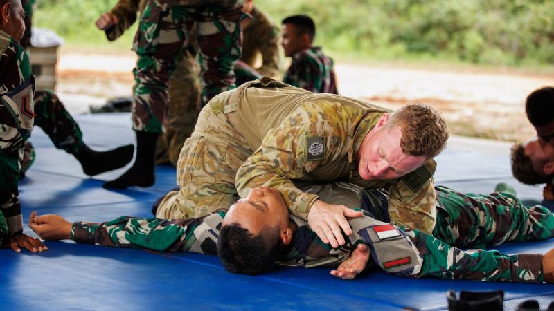 Australian Army Private Christian Scott from 5th Battalion, Royal Australian Regiment, practices Pencak Silat with Indonesian Army soldiers during Exercise Wirra Jaya at the Baturaja Training Area, South Sumatra, Indonesia. Photo: Corporal Dustin Anderson