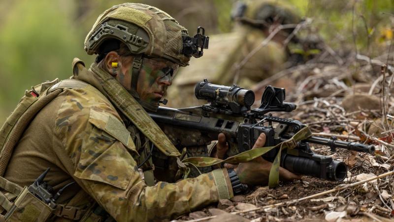 Private Mason Howell, of the 6th Battalion, Royal Australian Regiment, on patrol during live-fire training at Kokoda Barracks, Canungra. Photos: Signals Christopher Kingston