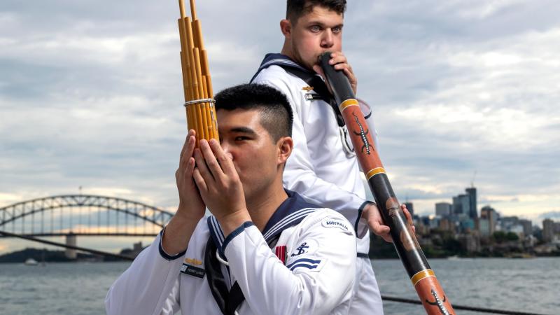 Leading Seaman Henry Liang and Able Seaman Lynton Robbins play traditional instruments during the recording of a music clip for Japan’s 29th International Fleet Review. Photo: Leading Seaman Jarryd Capper