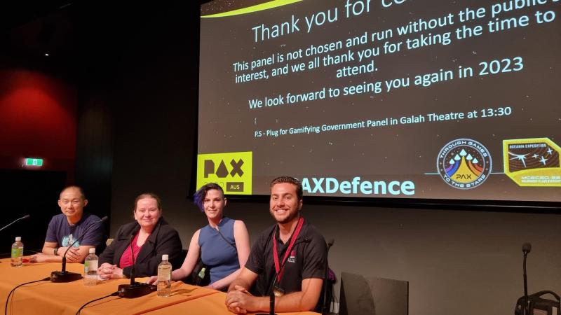 Defence scientists Mr Alex Rohl, right, and Dr Susannah Whitney, second from left, feature on a panel at PAX Aus 2022.