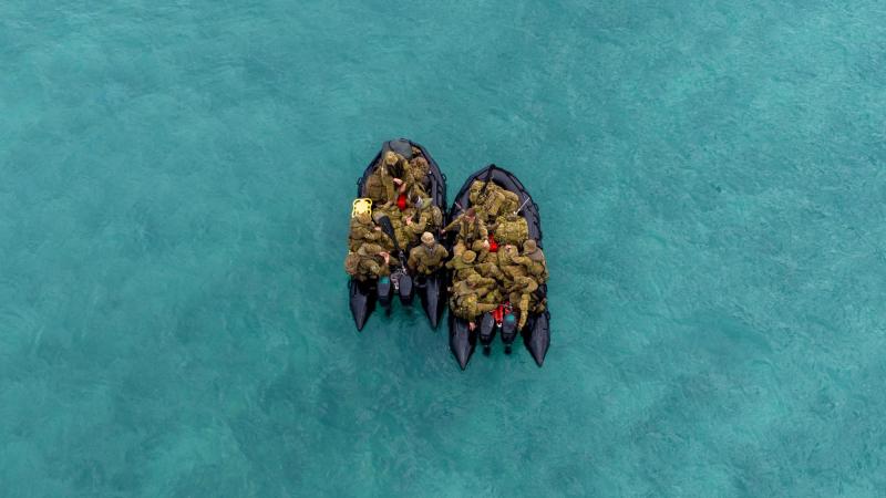 Soldiers from Regional Force Surveillance Group (RFSG) regroup while conducting water patrols on Maret Island, WA. Photo: Sergeant Jarrod McAneney