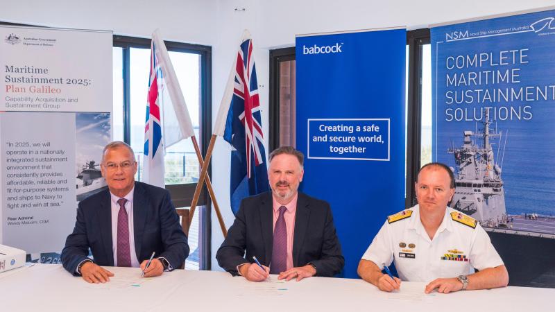Babcock Australasia’s CEO David Ruff, left, and Managing Director – Defence Andy Davis with Director General Major Surface Ships Commodore Brad Smith during the contract signing ceremony in Western Australia. Photo: Simon Casson
