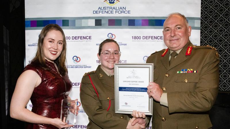 Major General Douglas Laidlaw, right, congratulates Mercury ISS’s Gabrielle Hendry, left, and Lieutenant Brooke Cooper at the NSW Employer Support Awards held in Sydney. Photo: Corporal Kylie Gibson
