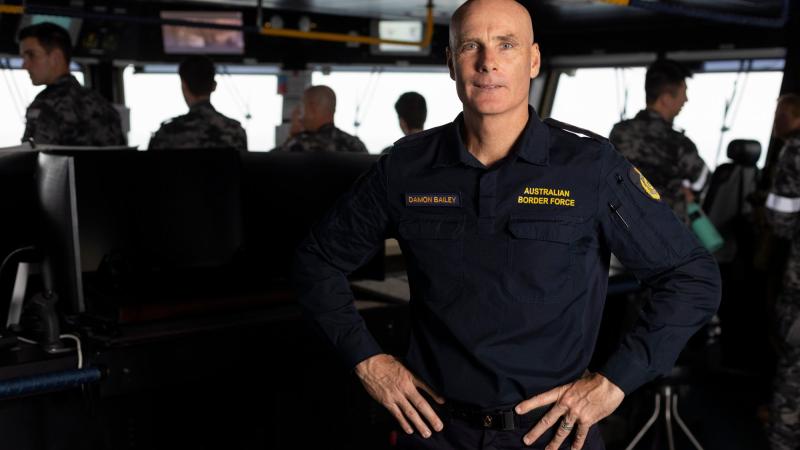 Australian Border Force Inspector Damon Bailey on the bridge of HMAS Adelaide during Indo-Pacific Endeavour 2022. Photo: Leading Seaman Sittichai Sakonpoonpol