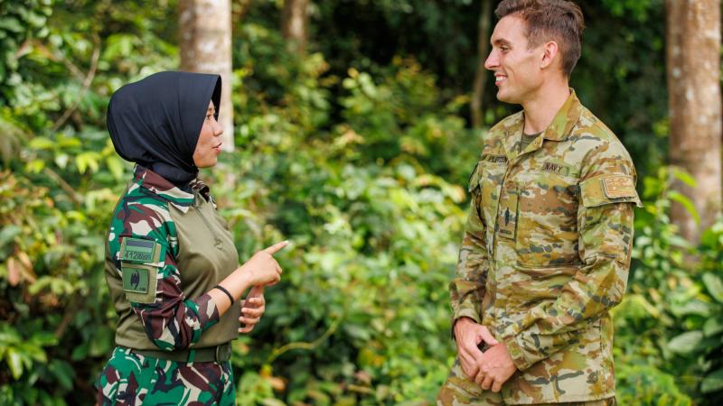 Royal Australian Navy Sailor Able Seaman Jamie Van Pletzen chats with an Indonesian Army Medic during Exercise Wirra Jaya at the Baturaja Training Area, South Sumatra, Indonesia. Photo: Corporal Dustin Anderson