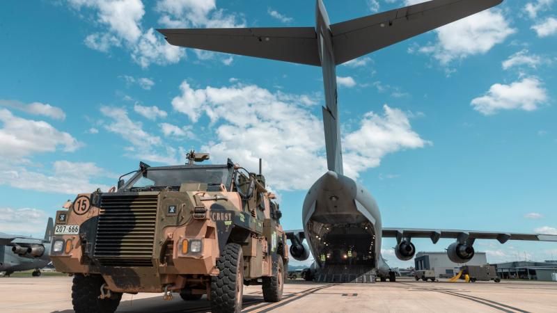 An Australian Army Bushmaster is loaded onto a RAAF C-17A Globemaster III during Exercise Ram Stallion at RAAF Base Amberley, Queensland. Photo: Corporal Nicole Dorrett