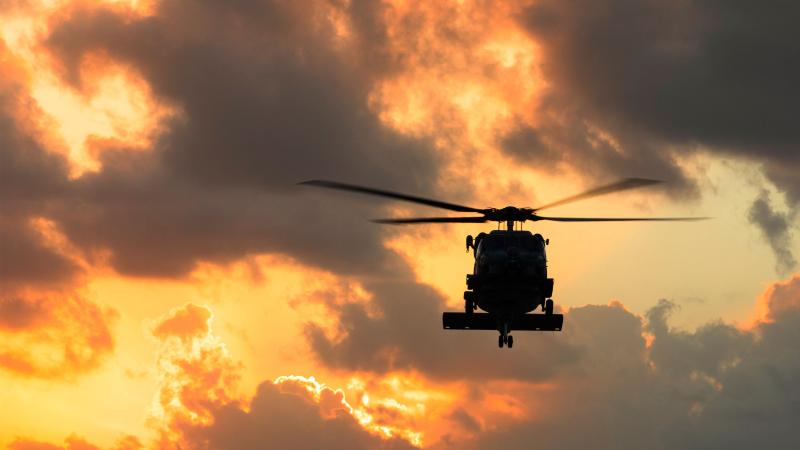 HMAS Hobart's embarked MH-60R helicopter Carnage returns to the ship during flying operations in the North Pacific Ocean as part of a regional presence deployment. Photos: Leading Seaman Daniel Goodman