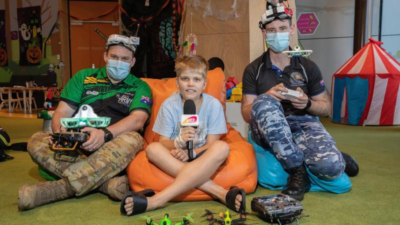 Army Sapper Alex Brown and Air Force Flight Lieutenant Jake Dell-O'Sullivan with 11-year-old Marlin Mott at Queensland Children's Hospital. Photo: Leading Aircraftwoman Kate Czerny