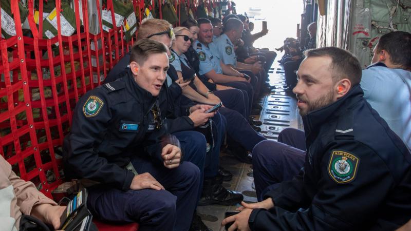 AFP and NSW Police officers aboard their flight on a C-130J Hercules aircraft as part of a Joint Military Police Unit community engagement day at RAAF Base Richmond. Photos: Leading Aircraftman Chris Tsakisiris