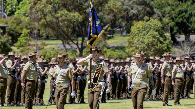(L-R) Escort to the Queen’s Banner Australian Army Sergeant Daniel Stevens, Queen’s Banner Ensign Lieutenant Frederic Carter and Escort Sergeant Sean Bellert parade the Queen’s Banner at Victoria Barracks, Sydney. Photos: Corporal Jacob Joseph