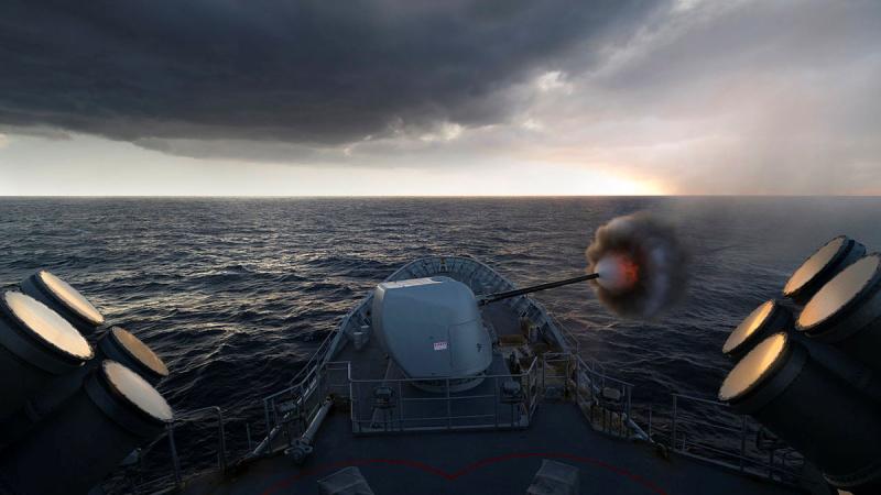 HMAS Arunta fires its 5-inch naval gun during a cooperative activity as part of Exercise Malabar 2022. Photos: Leading Seaman Susan Mossop
