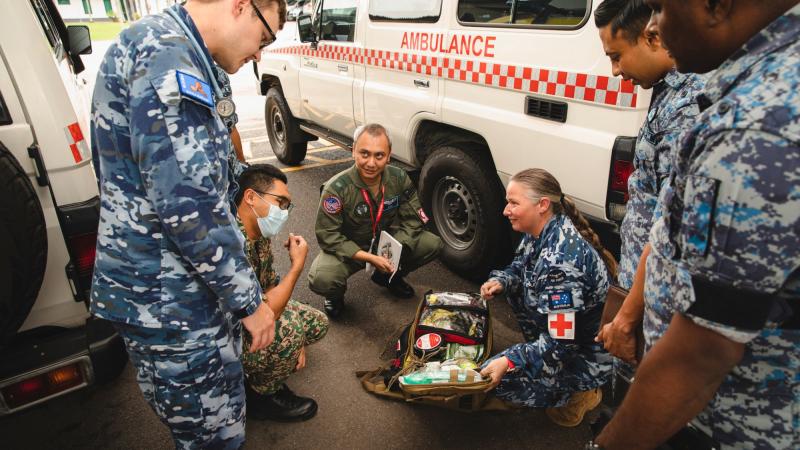 Flight Lieutenant Troy Gersbach, left, and Leading Aircraftwoman Amy Wardley alongside Malaysian Army and Air Force medical personnel during Exercise Elangaroo 22 in Malaysia. Photo: Leading Aircraftman Adam Abela