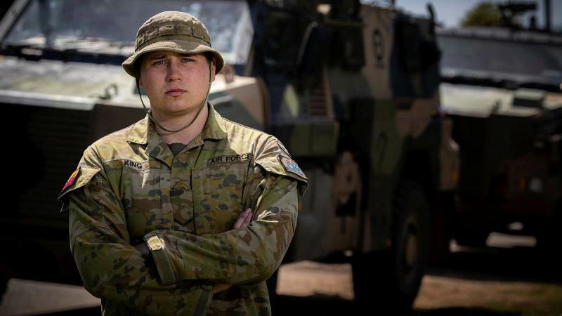 Royal Australian Air Force Leading Aircraftman Morgan King is driving a Bushmaster protected mobility vehicle in support of the flood effort in his home territory of Eugowra, NSW. Photo: Corporal Madhur Chitnis