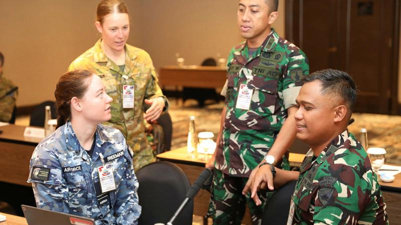 From left, Flight Lieutenant Stephanie Freeman, Captain Bianca Potter, Lieutenant Colonel Bayu Widaji and Major Rizka Budiman discuss Joint Logistics during Exercise Nusa Bhakti. Photos: Major Martin Hadley
