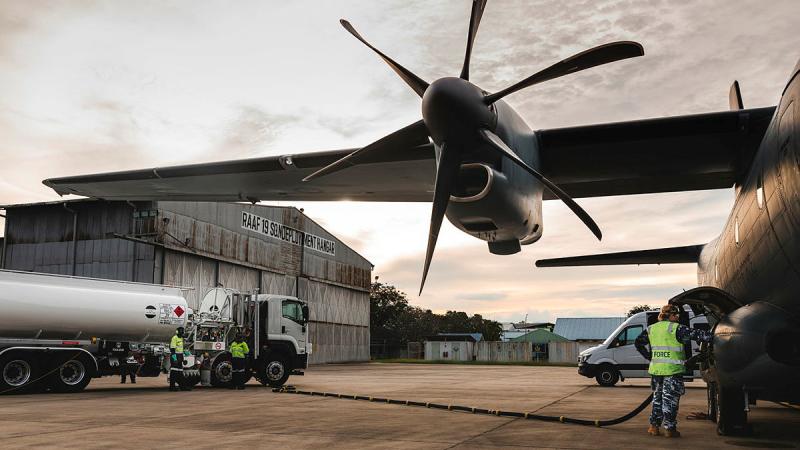 Personnel from 19 Squadron and 35 Squadron refuel a C-27J Spartan at RMAF Butterworth Air Base, Malaysia. Photos: Leading Aircraftman Adam Abela