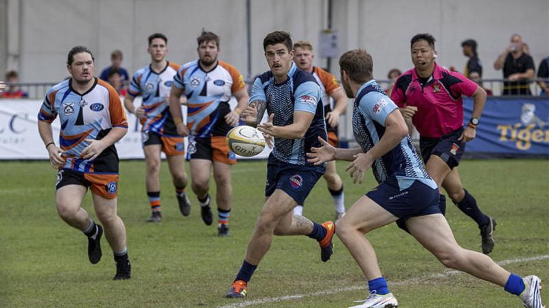 Craftsman Mathew Kelly, passes the ball during the 73rd Singapore Cricket Club International Rugby Sevens Tournament.
