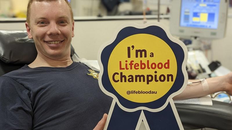 Flight Lieutenant Samuel Edwards being officially declared a Lifeblood Champion after making his 50th blood donation in Melbourne as part of the Defence Blood Challenge.