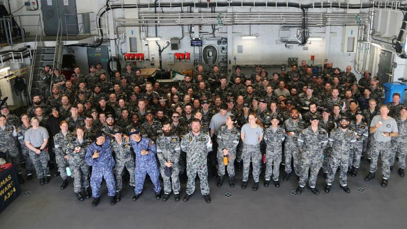 Ship's company and Japan Maritime Self-Defense Force personnel celebrate HMAS Stalwart's first birthday. Photo: Chief Petty Officer Aaron Robinson