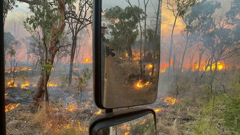Leading Aircraftwoman Toni Rutherford, RAAF Fire Fighter from 17 Squadron on the rear deck of a fire truck near Katherine. Photos: Flight Sergeant Mark Egan