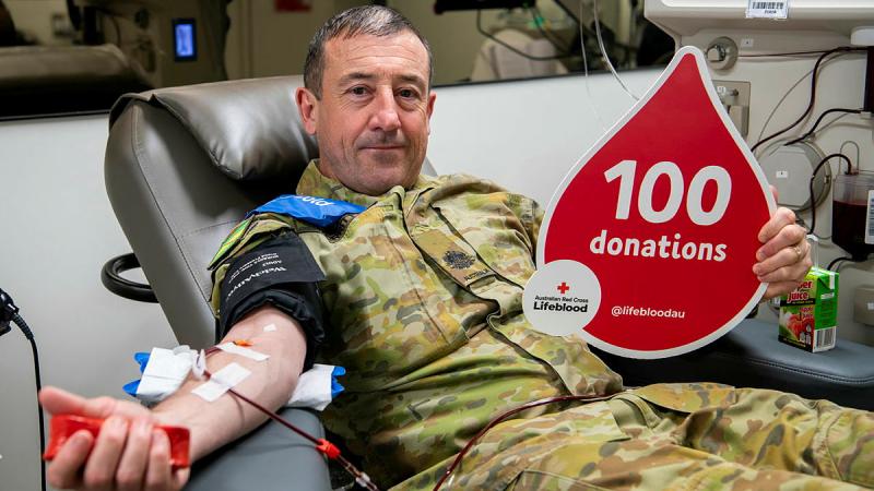Australian Army Warrant Officer Class One Peter Morritt makes his 100th donation to the Australian Red Cross Lifeblood centre.