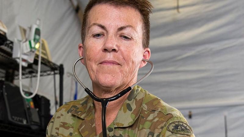 Major Dianne Hutchinson checks a patient's breathing rate during training at the Camp Taji Clinic at the Taji Military Complex, Iraq, in 2017. Photo: Able Seaman Chris Beerens