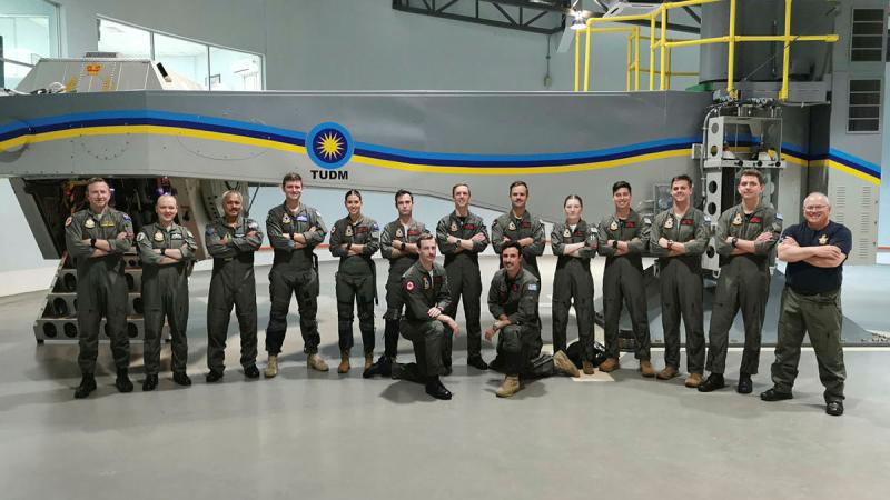 Participants in the RAAF/RMAF Pulls-G centrifuge training course in front of the RMAF centrifuge.
