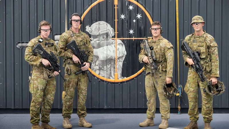 From left, soldiers from the1st Battalion, Royal Australian Regiment, Privates Shane Bagley, Frank Atkinson, Jack Dawes and Aleksandar Radovic in front of the first Live Fire in a Box on HMAS Adelaide.