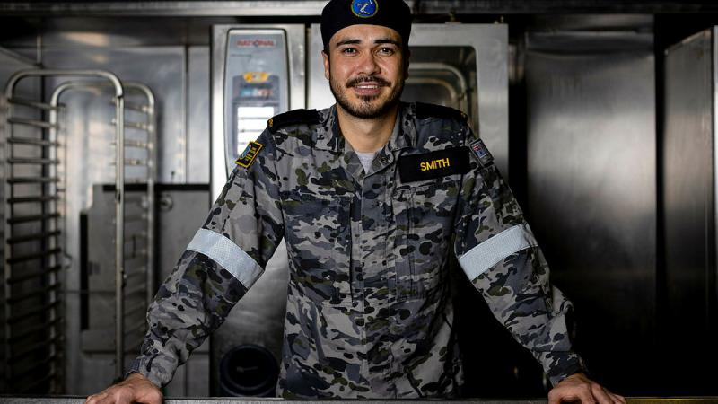Seaman Maritime Logistics Chef William Smith in the galley on board HMAS Adelaide. Photo: Leading Seaman Nadav Harel