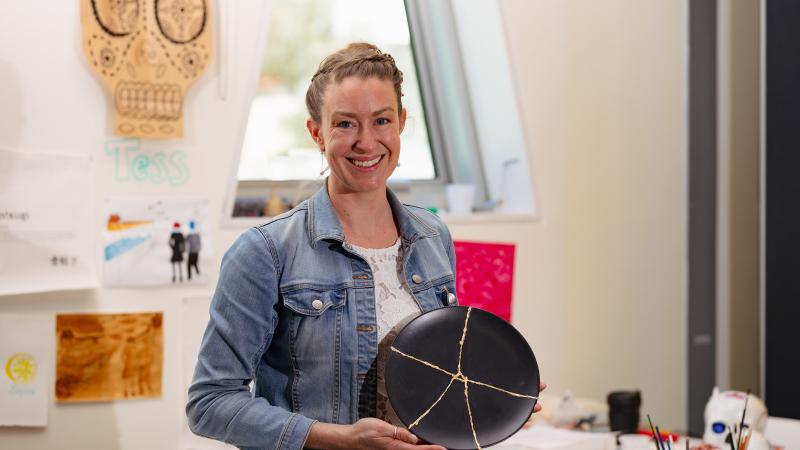 ADF ARRTS Program participant FLTLT Tess O'Brien with her art in the visual arts studio at the University of Canberra's Inspire Centre. Photo: CPL Olivia Cameron
