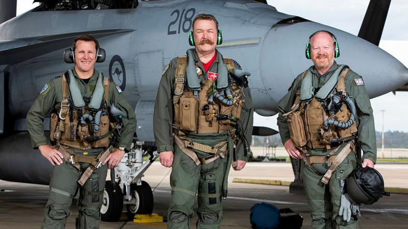 From left, Commanding Officer of 1 Squadron Wing Commander Stewart Seeney, Group Captain Paul Jarvis and Commodore Flotillas, Commodore Paul O’Grady, with an F/A-18F Super Hornet Photo: Leading Aircraftwoman Emma Schwenke