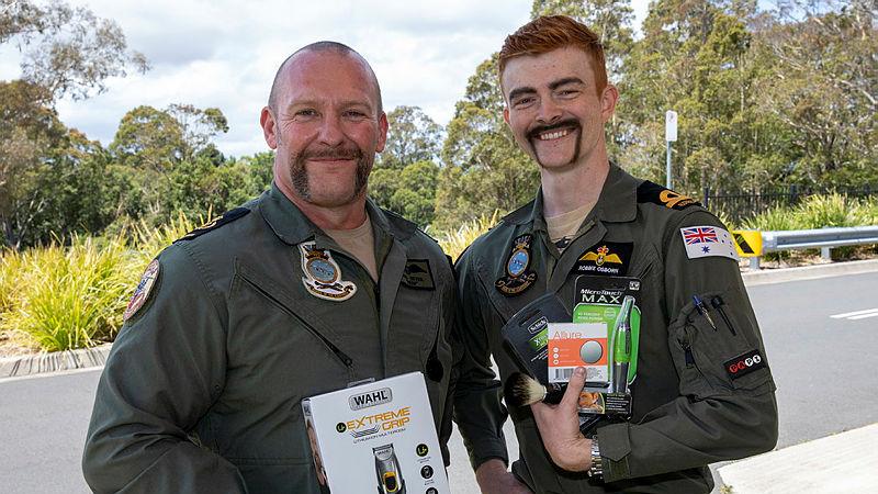 Chief Petty Officer Karl Beyer, left, the winner of best Movember moustache, along with the worst belonging to Acting Sub-Lieutenant Robbie Osborn. Photo: Petty Officer Justin Brown