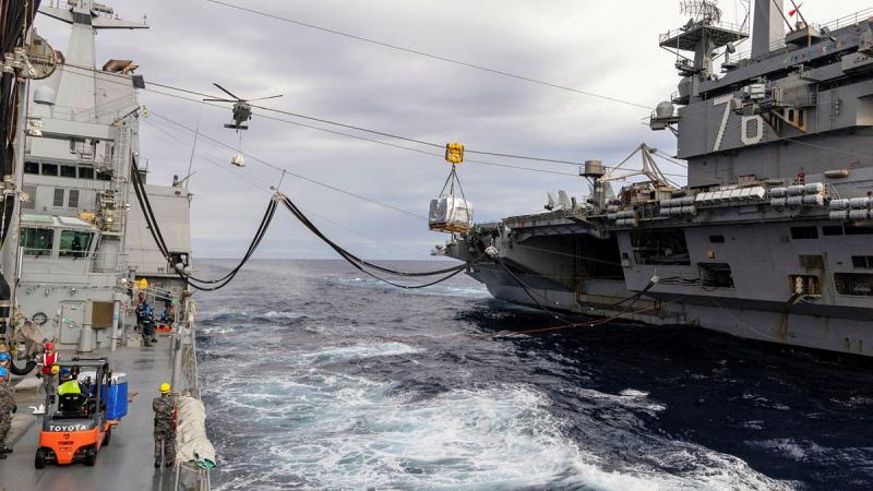 HMAS Stalwart conducts a replenishment at sea with aircraft carrier USS Ronald Reagan in the North Pacific Ocean. Photos: Chief Petty Officer Aaron Robinson