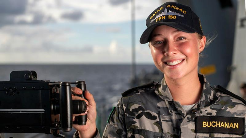 Navy Sailor Seaman Boatswain's Mate Kelsey Buchanan at the ship’s 12.7mm (.50 cal) machine gun on board HMAS Anzac. Leading Seaman Jarryd Capper