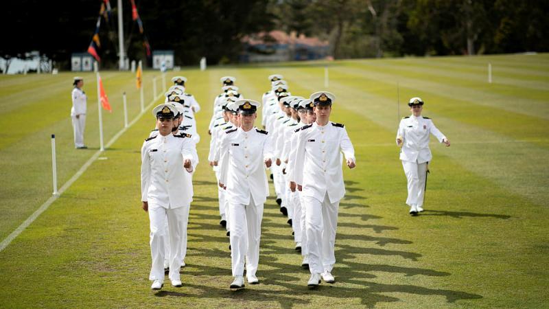 Members of New Entry Officers Course 67 conduct a march past during their graduation ceremony at HMAS Creswell. Photo: Leading Seaman Ryan Tascas