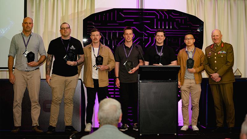 Chief of Joint Capabilities Lieutenant General John Frewen (right) with the winners of the first ADF team in the Capture the Flag at the 2022 Cyber Skills Challenge. Photo: CPL Olivia Cameron