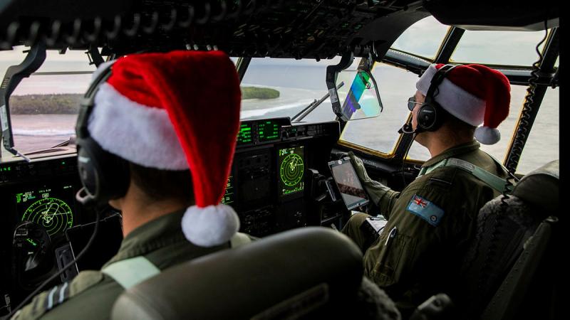 Pilots from 37 Squadron fly over the community of Mokil in Micronesia prior to dropping humanitarian aid stores. Photo: Corporal Kieren Whiteley