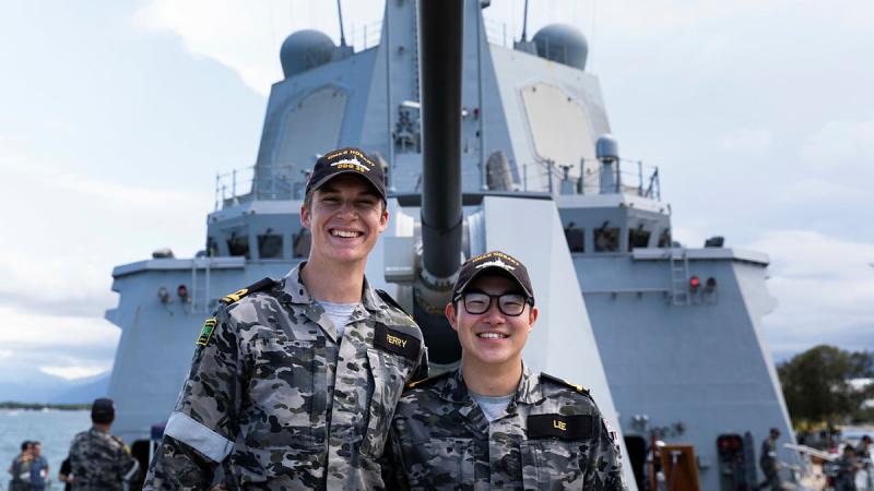  Acting Sub Lieutenant Lachlan Ferry, left, and Acting Sub Lieutenant David Lee on the forecastle of HMAS Hobart. Photo: Leading Seaman Daniel Goodman
