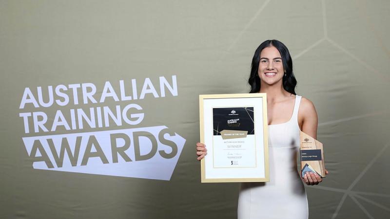 Defence Industry Pathways Program graduate Brittany-Leigh Wragg with her Australian Trainee of the Year Award.