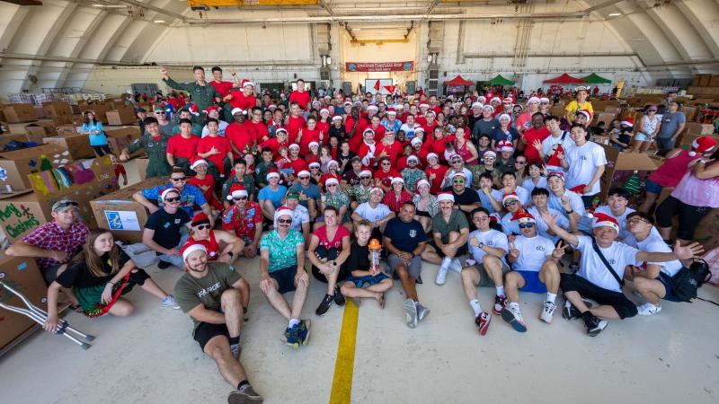 Members of RAAF and the United States, New Zealand, Japan and South Korean air forces pose for a group photo during Operation Christmas Drop 2022 at Andersen Air Force Base, Guam