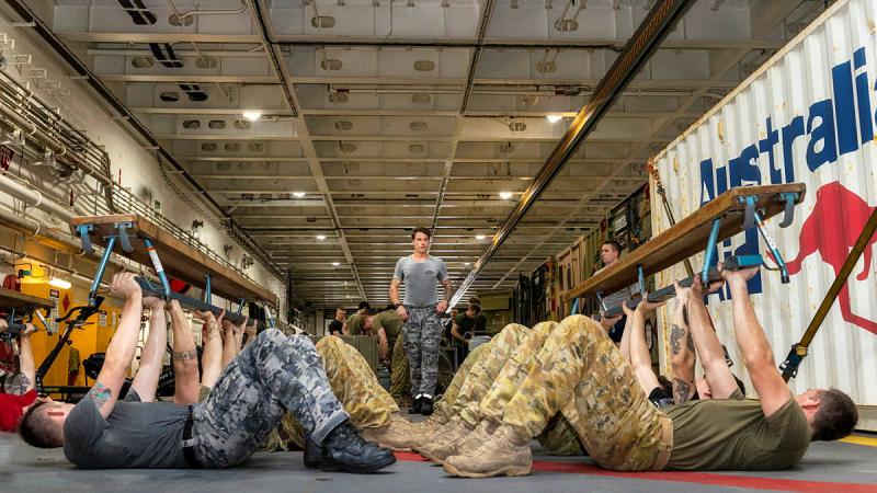 Physical training instructor Petty Officer Jacob Machen conducts the first ADF Fitness Leaders course at sea on board HMAS Adelaide. Photo: Leading Seaman Sittichai Sakonpoonpol