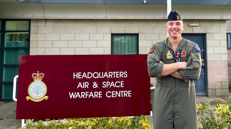 Squadron Leader Adam Lawson standing outside the Royal Air Force's Air and Space Warfare Centre Headquarters, RAF Waddington, Lincolnshire UK