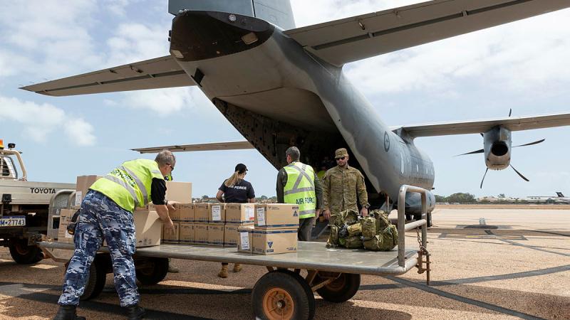 Urgent medical supplies are loaded onto a Royal Australian Air Force C-27J Spartan aircraft for delivery to the isolated town of Derby in the Kimberley region during Operation Flood Assist 23-1. Photos: Leading Seaman Jarrod Mulvihill
