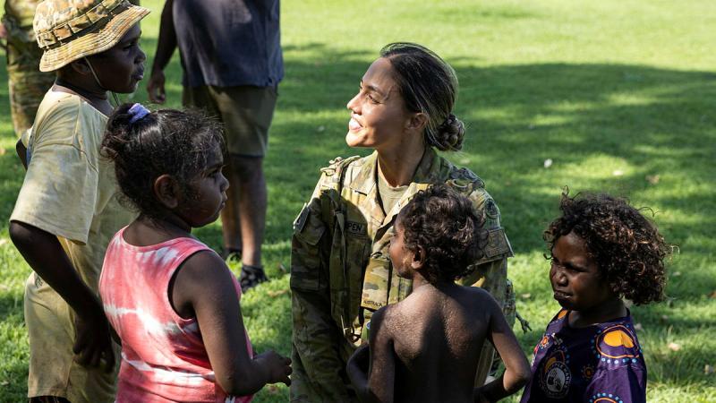 Army Trooper Katherine Van Kampen talks with local children during a key leadership engagement meeting with Indigenous Elders and members of the Fitzroy Crossing township. Photos: Leading Seaman Jarrod Mulvihill