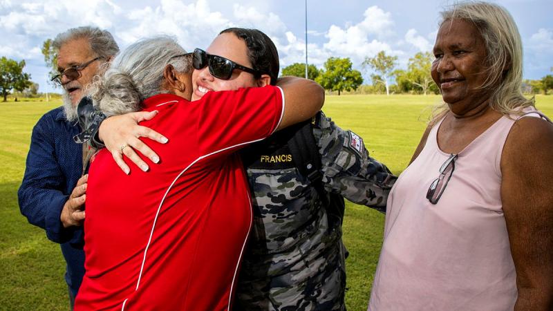 Leading Seaman Teneille Francis is welcomed home by members of her family during a community day held at Fitzroy Crossing, Western Australia. Photos: Sergeant David Said
