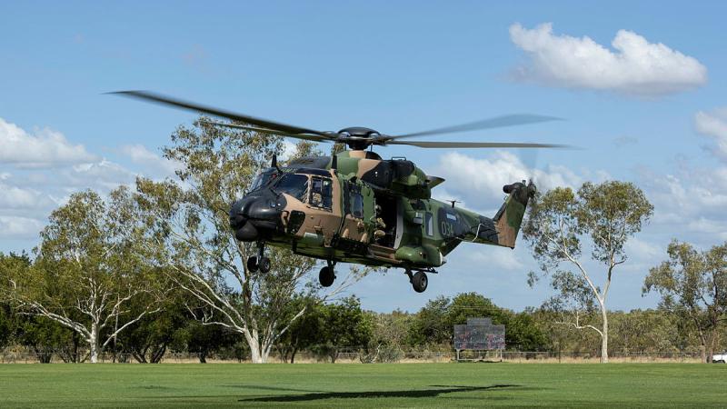 An Army MRH-90 Taipan lands in a football field in Fitzroy Crossing, in Western Australia's Kimberley Region, where heavy rainfall from Ex-Tropical Cyclone Ellie has isolated communities. Photo: LSIS Jarrod Mulvihill
