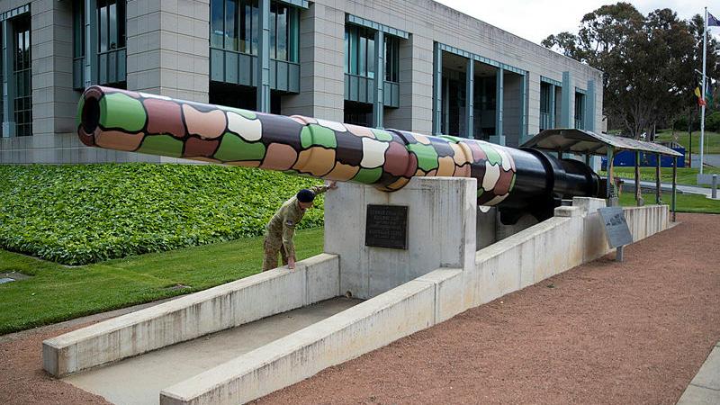 An Australian soldier inspects the barrel of the Amiens Gun located at the Australian War Memorial, Canberra. Photo: Private Nicholas Marquis