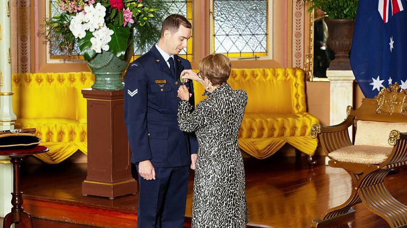 Corporal Joe Kelly receives his Conspicuous Service Cross late in 2022 from The Governor of New South Wales, Her Excellency the Honourable Margaret Beazley. Photo: Flight Lieutenant Julia Ravell.