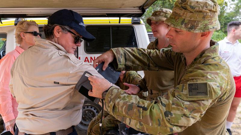 Australian Army soldier Private Thomas Marshall, right, from the 3rd Health Battalion, fits a blood presser cuff to Megan Stifler, Deputy Commissioner Strategic Capability, Fire and Rescue NSW. Photos: Corporal Michael Currie.