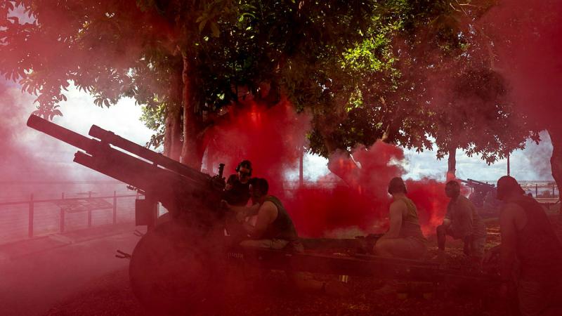Soldiers from 8th/12th Regiment, Royal Australian Artillery, fire historical M2A2 105mm howitzers as part of a re-enactment during the bombing of Darwin commemorative service. Photo: Leading Seaman Leo Baumgartner